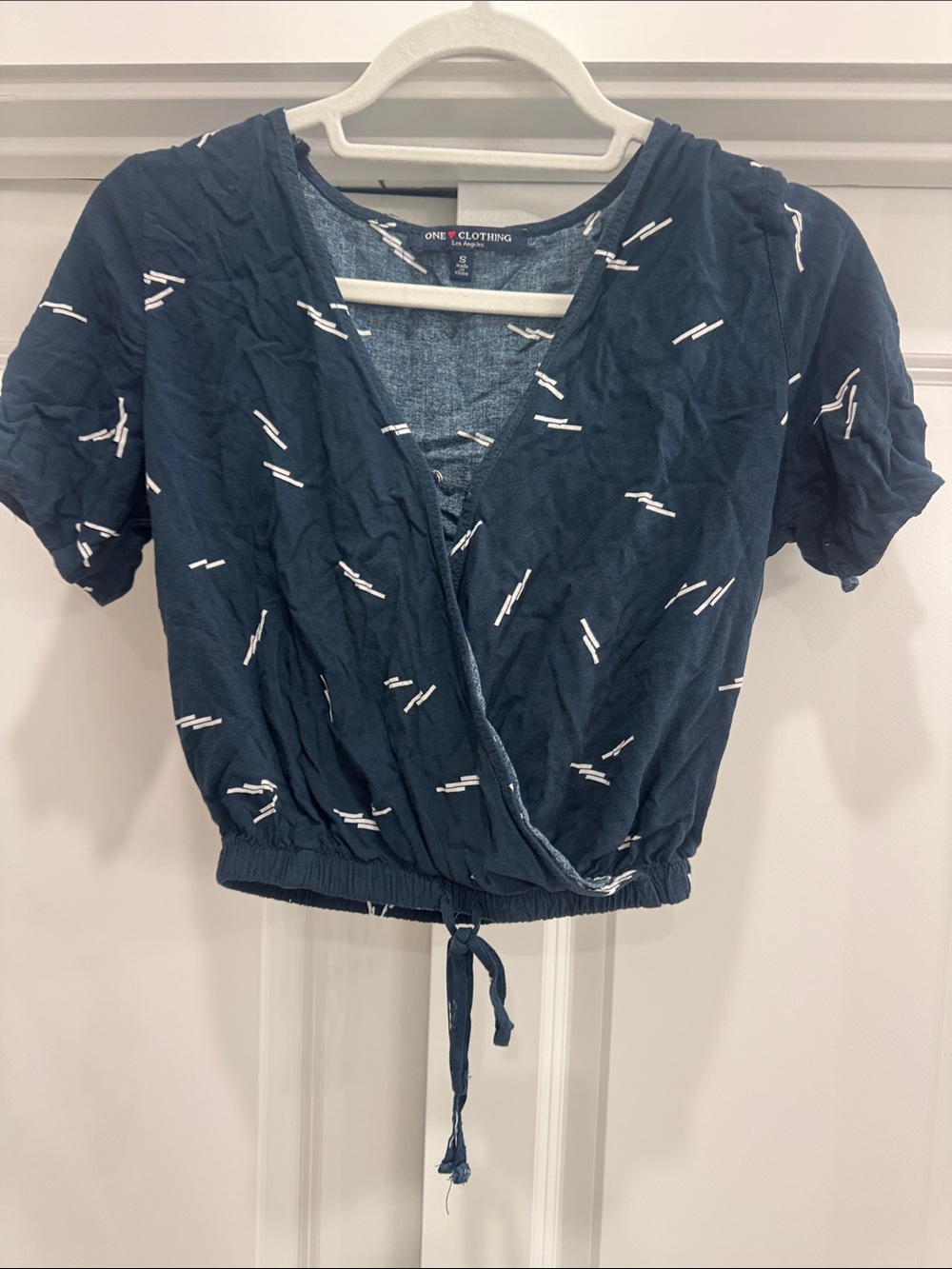 one clothing navy wrap crop top with white accent print